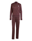tuta Adidas Track Essentials aurora rubino, mostrando la vestibilità e lo stile contemporaneo