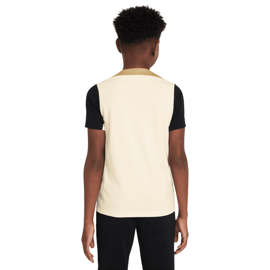 Vista posteriore della maglia da calcio Nike Dri-FIT Strike per ragazzi in avorio con dettagli neri
