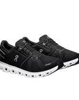 Vista frontale delle scarpe running On Cloud 6 uomo nero-bianco, punta ergonomica per comfort ottimale