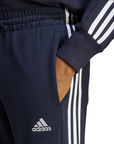 Adidas pantalone sportivo in cotone garzato  con banda e polsino Essentials Tapered Cuff IC9406 legend ink